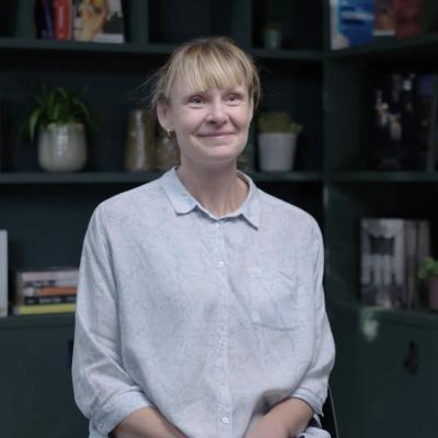 Female teacher being interviewed in library