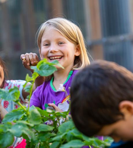 Primary student learning outdoors garden