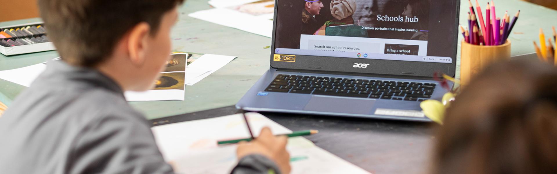 Student looking at laptop