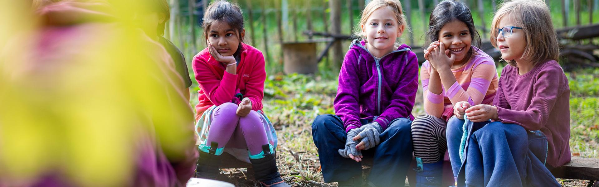 Children by a campfire